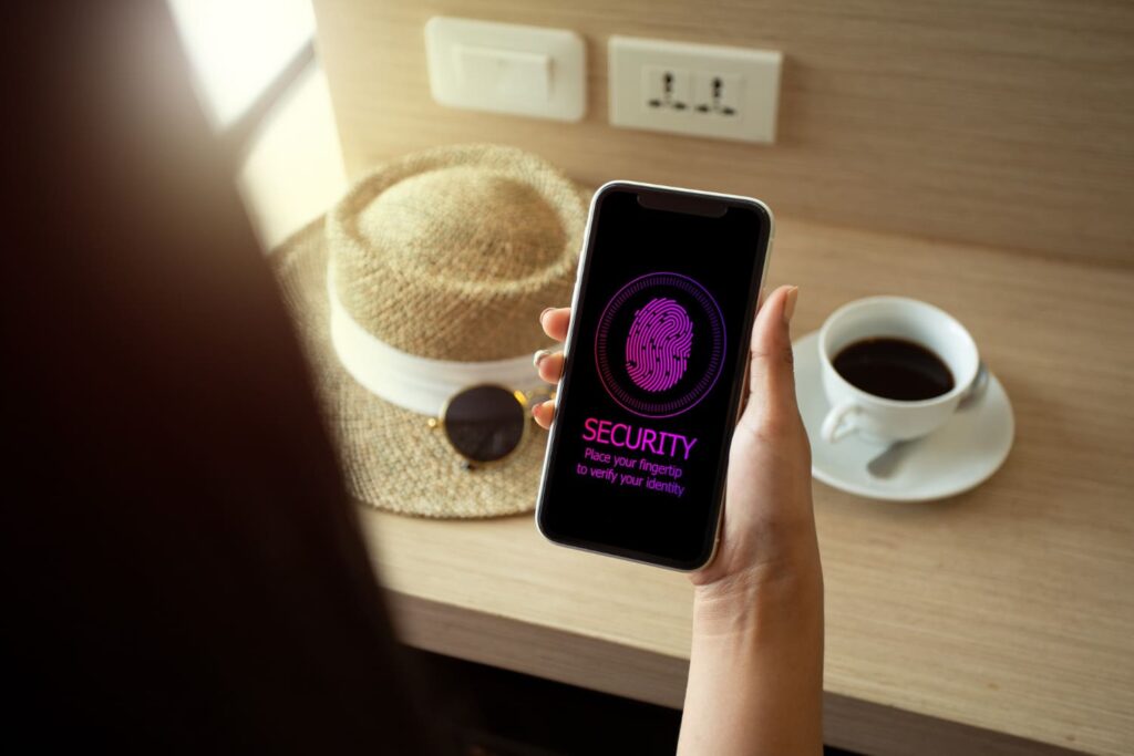 A woman using a smartphone with a fingerprint security system