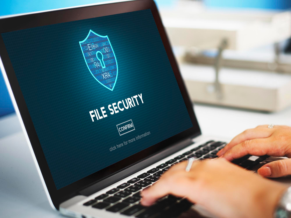A laptop with screen that shows the system is secured by the antivirus