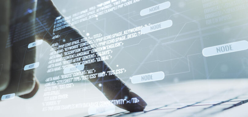 A hand pointing out on a keyboard