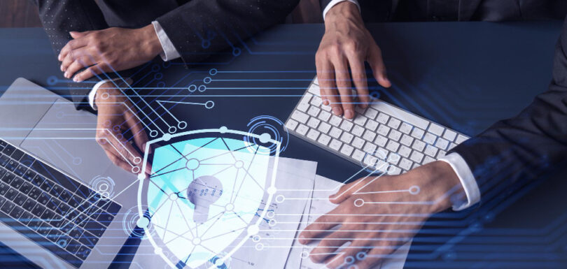 Two men discussing cyber insurance