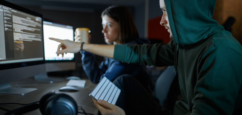 Two hackers working on a watering hole attack